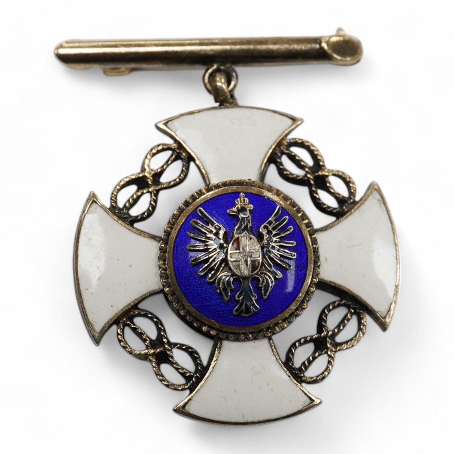 A North American yellow metal and two colour enamelled medallion, 23mm, with suspension brooch, brooch stamped 14k. Condition - fair to good